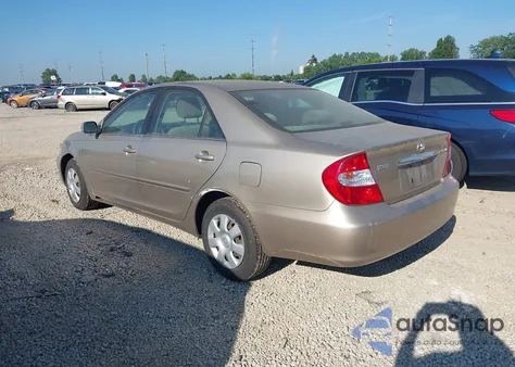 2003 Toyota Camry Le z USA, uszkodzony, nr VIN JTDBE32K130239667
